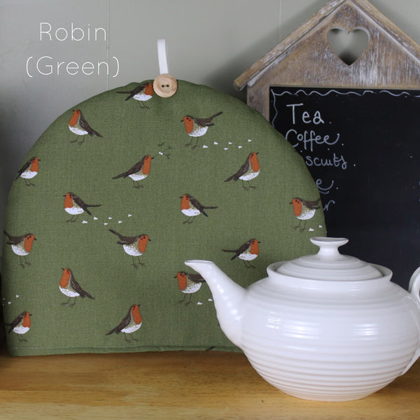 Christmas tea cosy. Handmade in Sophie Allport Christmas Fabrics. Robin, Mistletoe Owl Holly Christmas fabric.