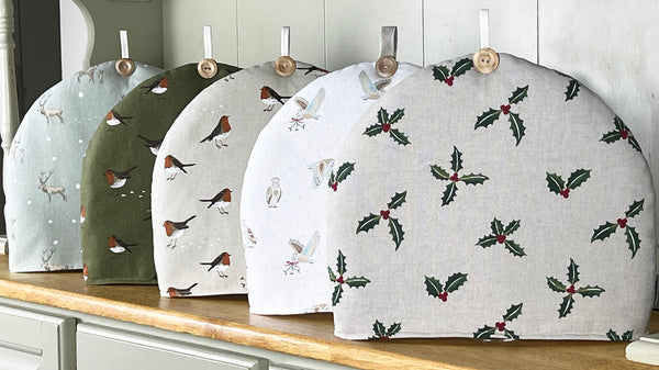 Christmas tea cosy. Handmade in Sophie Allport Christmas Fabrics. Robin, Mistletoe Owl Holly Christmas fabric.